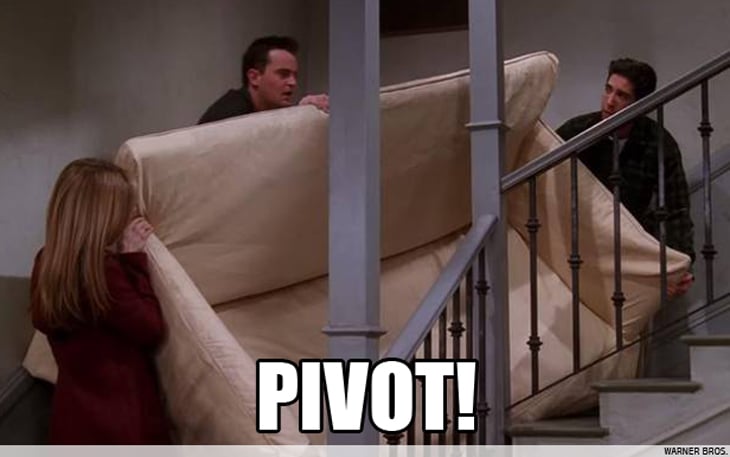 Friends trying to move a couch up the stairs but need to pivot.